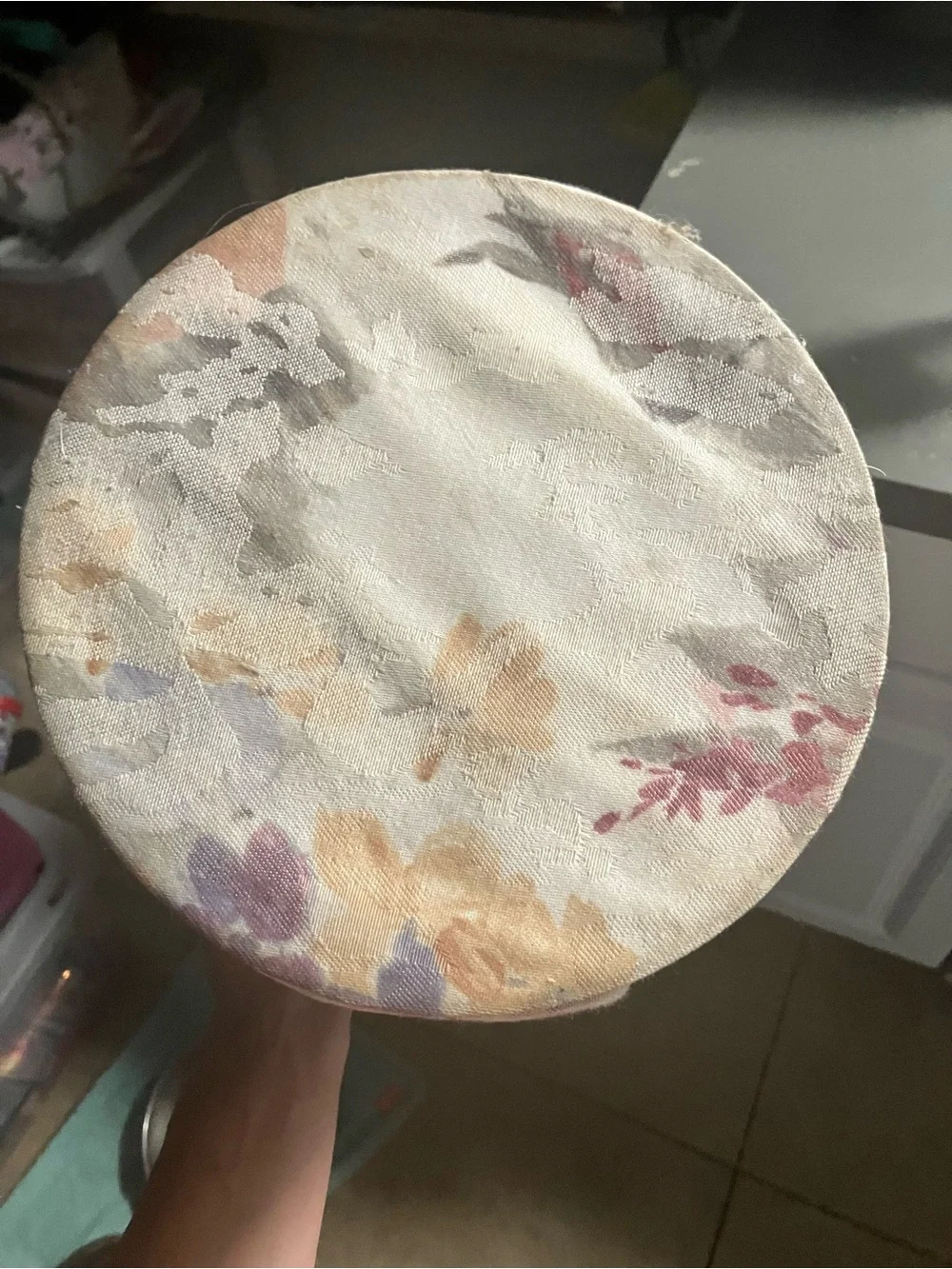 2 vintage floral tapestry fabric wastebaskets with plastic liners in them